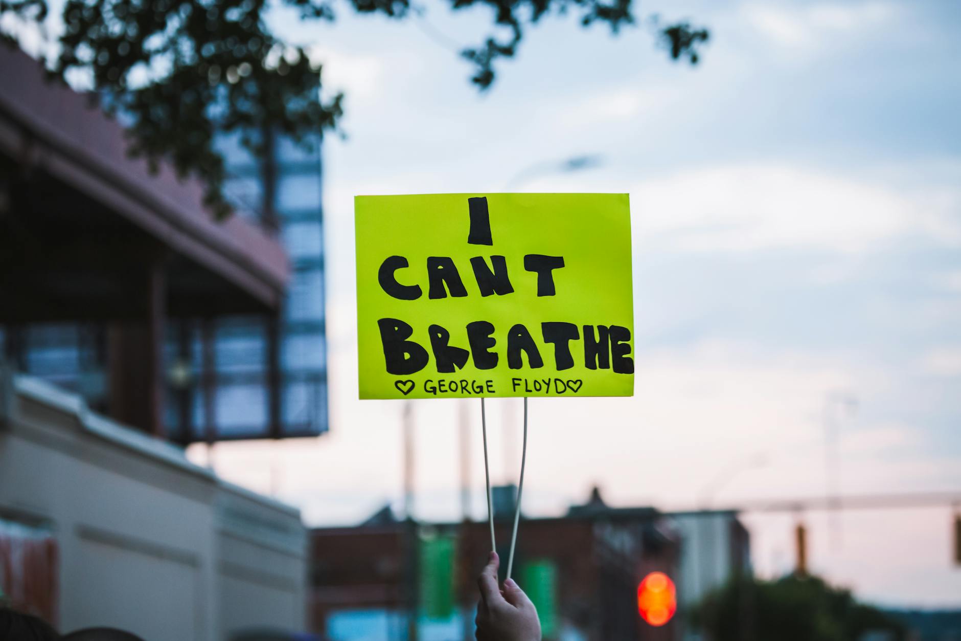 Crop faceless person showing paper with i can t breath inscription during Black Lives Matter movement demonstration